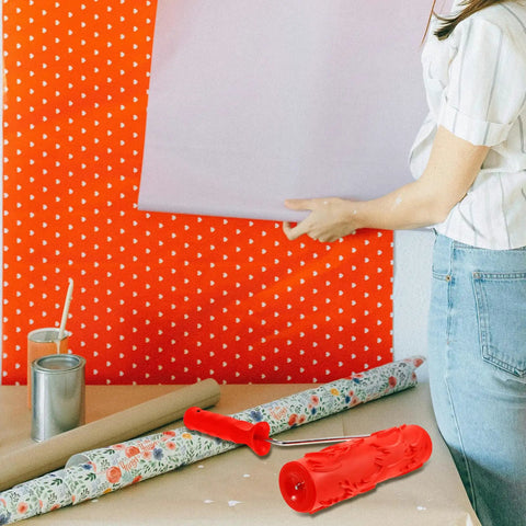 Heavy Duty Textured Rubber Paint Roller For Decorative Accent Walls DIY Hella Smooth Embossing Designs With Comfortable Grip Handle showing red roller next to wallpaper.