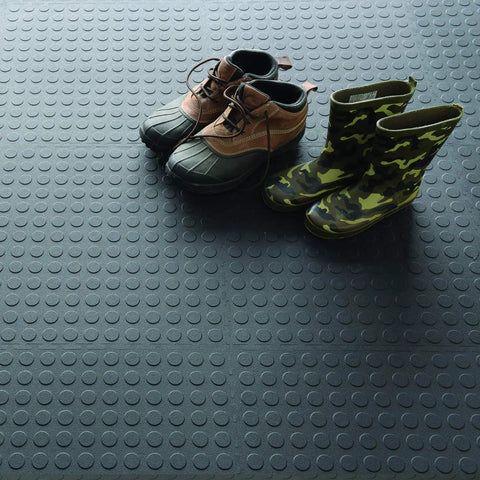 Interlocking 18x18 Inch Rubber Floor Tiles for Home Gym with shoes on raised coin pattern surface, durable, easy install.