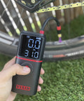Slick Rechargeable Tire Inflator And Portable Air Compressor Featuring Digital Led Display and Automatic Shutoff, showing pressure gauge and hose.