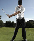 Man practicing golf swing outdoors, using Right Handed Golf Tempo And Grip Trainer For Indoor And Outdoor Practice With Adjustable Weight