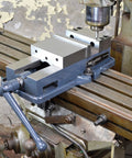 Heavy Duty 6 Inch Milling Machine Vise Crafted From Tough Ductile Iron With Hardened Steel Smooth Jaws on a CNC mill table.