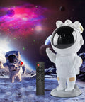 Starry Nebula Projector Night Light With Remote And Timer For Ceiling And Wall Projection 17 Modes Create Chill Bedroom Vibes Relaxing Mood Perfect Gift For Kids And Adults showing astronaut figure with cosmic scene background