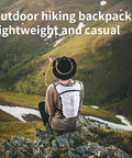 Person wearing Ultra Lightweight Hydration Backpack For Women With 1.5L Water Bag No Bounce Running Vest in white, sitting on a hill.