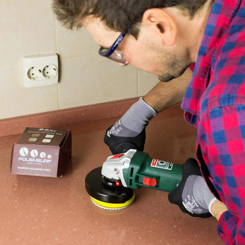 Man using Pro Grade 4 Inch Diamond Polishing Pads Set For Wet Or Dry Use 7 Piece Kit on countertop
