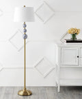 Bold Brass Gold And Blue Midcentury Ceramic Floor Lamp With Hand Painted Porcelain And White Linen Shade Coastal Classic Style LED Bulb Included For Effortless Bright Ambience next to a white cabinet