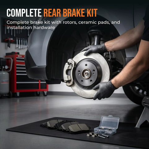 Mechanic installing rear brake kit with carbon ceramic rotors for 2010 to 2018 Hyundai Santa Fe Sport Santa Fe XL and 2011 to 2020 Kia Sorento