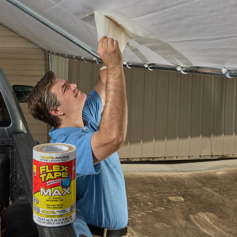 Man using heavy duty rubberized waterproof tape for patching leaks and sealing under awning, 12 in x 10 ft pack of 2, white