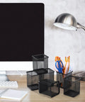 Six Piece Slatwall Cups And Hooks Organizer Set Black Metal Mesh Wire Holder on desk near computer and lamp.