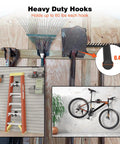 Heavy Duty Wall Mounted Garage Storage System With A 48 Inch Adjustable Rack And Snap On Hooks, gardening tools and bicycle organized