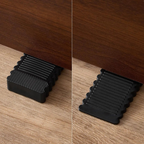 Rock Solid Black Rubber Wedge Shims For Furniture Leveling in use under cabinet legs adjusting height on a wooden floor.