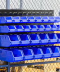 Heavy Duty Storage Bin Wall Panel System With 15 Bins Bench Mountable Steel Panels Expandable Garage Organizer For Tools Parts Hardware And More For Quick Access installed outdoors