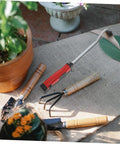 Lightweight Garden Hand Hoe Weeding Tool With Non Slip Handle for easy weeding next to gardening tools on a burlap mat