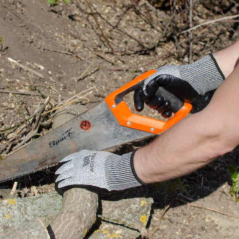 Person cutting wood with a saw, wearing Level 5 Cut Resistant Construction Work Gloves With Foam Nitrile Coating For A Grip Like A Pro