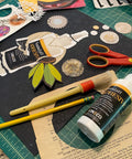 Neutral pH All Purpose Glue For Book Binding And Crafts, 8 Oz, Acid Free Adhesive with craft tools and paper cutouts.