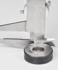 Dial Caliper With 0-6 Inch Range, Precision To 0.001 Inch, measuring depth with black body, knurled lock visible, metal surface