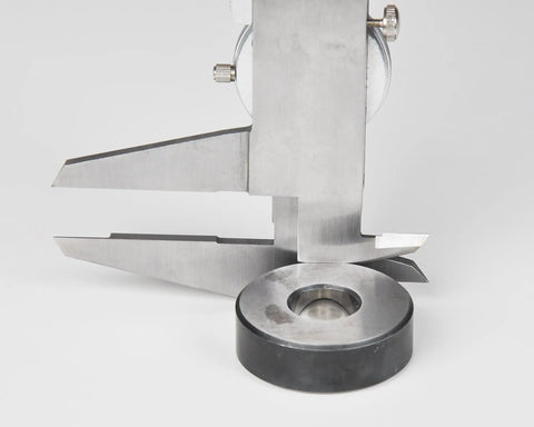 Dial Caliper With 0-6 Inch Range, Precision To 0.001 Inch, measuring depth with black body, knurled lock visible, metal surface