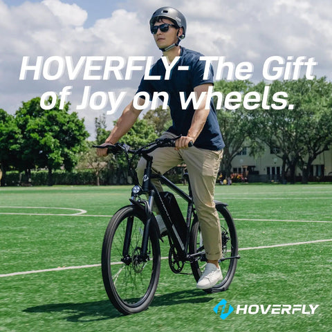 Person riding a hoverboard bicycle on a green field, wearing protective gear and sunglasses.