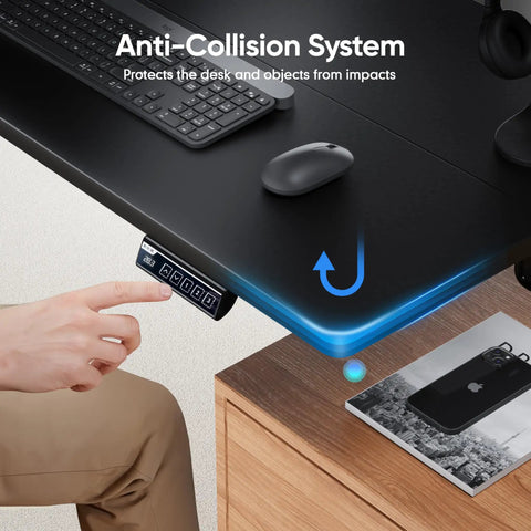 Man adjusting Electric Height Adjustable Standing Desk 48 By 24 Inches With Ergonomic Sit Stand Design, black top, anti-collision feature.