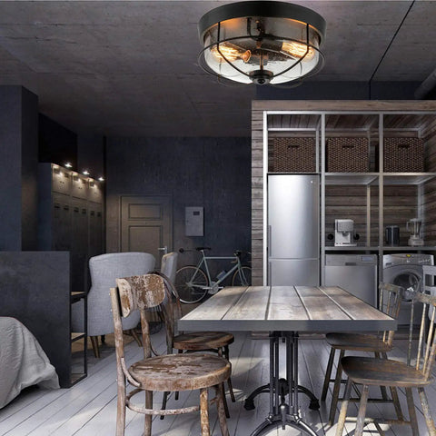 Industrial Black 13 Inch Flush Mount Ceiling Light With Seeded Glass Shade And Metal Cage in a vintage style kitchen setting.