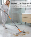 Woman using Silicone Floor Squeegee For Shower Glass Tiles Garage Floors And Windows No Streaks Flexible Wiper Pet Hair Remover Heavy Duty Easy Clean Multi Surface Tool With Compact Storage to clean bathroom floor.