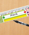 Self Adhesive Desk Nameplates Set For Primary Students Pack Of 36 14 By 4 Inches with marker on wood surface