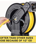 Person handling a reel with a Hybrid Air Hose One Half Inch By Four Feet With One Half Inch MNPT Ends in a garage setting.