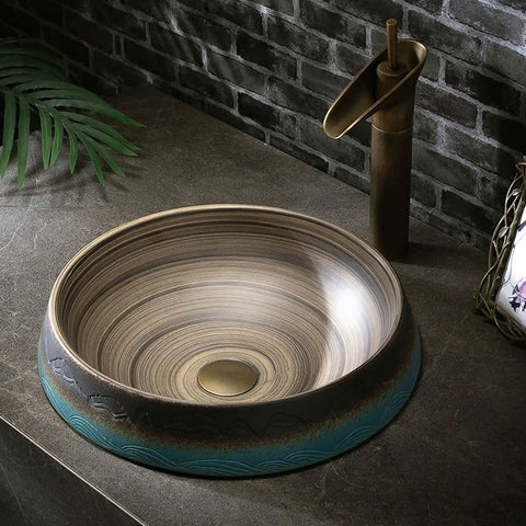 Bathroom Vessel Sink Vintage Hand Engraving Skirted Vessel, Ceramic Round Sink, showing unique swirl design in elegant bathroom setting.