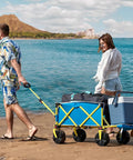 Beach Wagon With Big Wheels For Sand Heavy Duty Collapsible Cart With Tailgate Foldable Utility Wagon in blue on beach