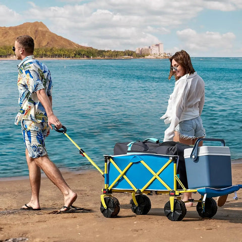 Beach Wagon With Big Wheels For Sand Heavy Duty Collapsible Cart With Tailgate Foldable Utility Wagon in blue on beach