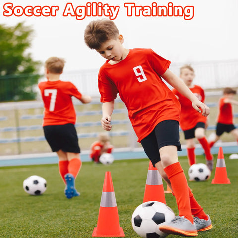 Boys practicing soccer agility around Top Notch High Visibility 15 Inch Traffic Cones With Reflective Collars on field