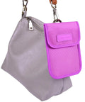 Purple RFID Key Fob Protector And Faraday Bag For Car Key Signal Blocking Anti Hack Anti Theft Pouch hung on a grey handbag