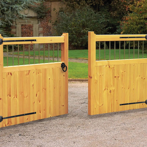 Wooden gate with 24 Inch Black T Strap Gate Hinges Set - Heavy Duty 2 Pack With 14 Mounting Screws, ideal for sheds and barns.