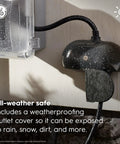 Cync Outdoor Smart Plug With Bluetooth And Wi-Fi Weather-Resistant Outdoor Outlet Socket in use, covered in rain droplets