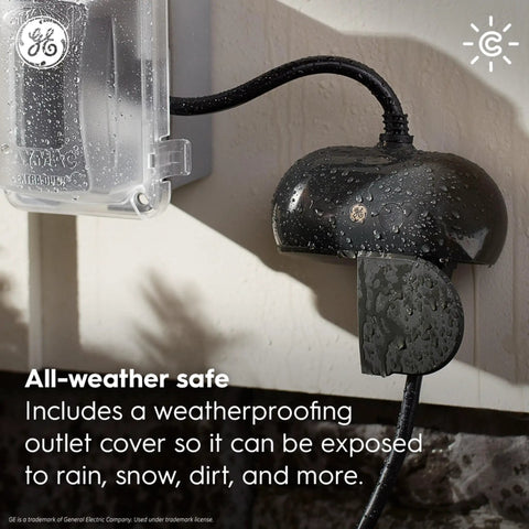 Cync Outdoor Smart Plug With Bluetooth And Wi-Fi Weather-Resistant Outdoor Outlet Socket in use, covered in rain droplets
