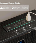Close-up of recessed power strip on black Gaming Desk With RGB LED Lighting And USB Type-C, 47 Inch Computer Desk With 6 Drawers.