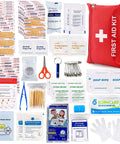 Front view of red zippered first aid kit pouch with white cross; contains bandages, wipes, scissors, tweezers, gauze.