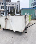 3 Ton Farm Jack 60 Inch Heavy Duty Ratcheting Off Road Utility Jack With 6600 Lb Capacity lifting a large metal container