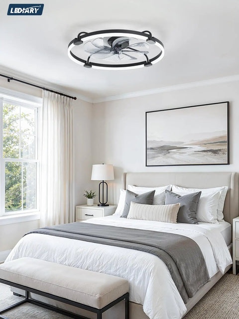 24 Inch Low Profile Ceiling Fan With Brushless Dc Motor And Smart App Remote Brings Fresh Cooling Vibes To Bedrooms Or Living Rooms While Featuring Stepless Dimmable LED Light And Tunable Warm Cool Tones In Matte Black in a modern bedroom setting.