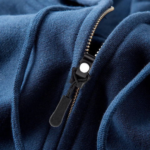 Close-up view of zipper slider on blue fabric using Zipper Repair Kit With Slider Fix Tool Quick Zip Replacement Instant Zipper Mending Set Slider Substitute Pack Repair Kit For Jackets Bags And Travel Gear Easy DIY Fix
