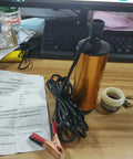 Beefy 12V Submersible Water Transfer Pump with accessories on desk, ideal for diesel kerosene and water, featuring stainless steel shell