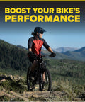 Cyclist riding a mountain bike in scenic landscape with text 'Boost Your Bike’s Performance'