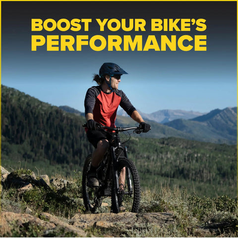 Cyclist riding a mountain bike in scenic landscape with text 'Boost Your Bike’s Performance'