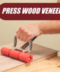 Extendable Heavy Duty Floor And Wall Roller applying pressure on wood veneer surface with ergonomic handle