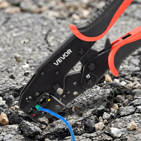 Heavy Duty Ratcheting Wire Crimper Pliers For 22 To 10 AWG Electrical Terminals in action on gravel surface.