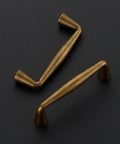 Antique Brass 3 Inch Cabinet Pulls from 30 Pack in Solid Zinc Alloy for Kitchen Cabinets and Cupboards, on black background.