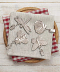 4 Pack Tablecloth Weights With Metal Clips Clamps For Outdoor Parties And Picnics, Cast Iron Weights In Butterfly Bee Dragonfly And Ladybug Shapes, displayed on cloth napkin