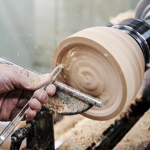 Top Notch M2 High Speed Steel Cryogenically Treated Bowl Gouge For Woodturning cutting a wooden bowl on a lathe with a beech wood handle.