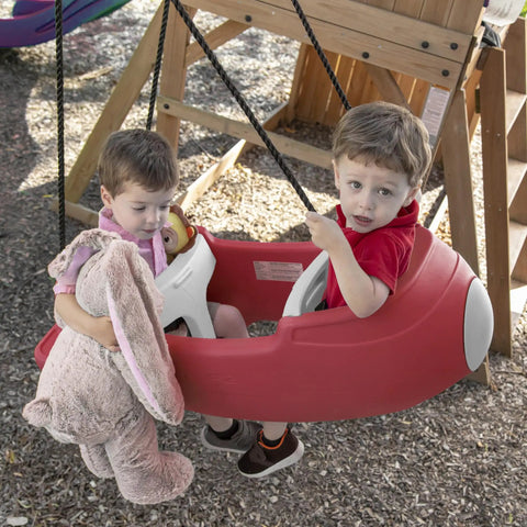 Two toddlers sitting on a Rocket Swing For Two Outdoor Baby Swing With Weather Resistant Rope Attaches To Your Playset In The Backyard.