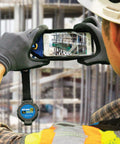 Worker using Pro ToolMate Retractable Tool Tether And Smartphone Jacket Kit, 1 lb lanyard, ANSI 121 Certified, in outdoor setting.