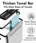 Close-up of matte black over the door towel rack with thick bars drying blue and gray towels, dimensions highlighted.